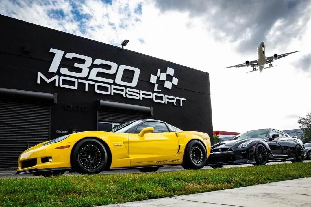 1320Motorsport shop in Miami with a yellow Corvette Z06 and a Nissan GT-R parked out front